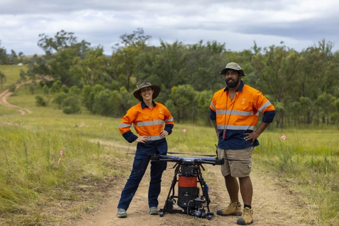 AirSeed’s chief ecologist Charlotte Mills and chief remote pilot Ru Maka at a project site in Queensland