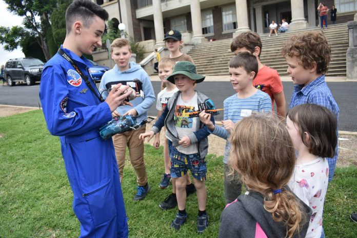 Student ambassador Josh teaching youth from Armidale about drone safety.