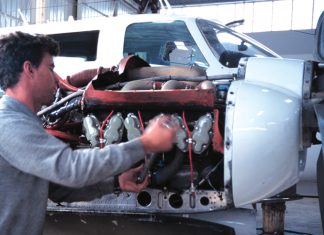 Aircraft engineer working on an engine.
