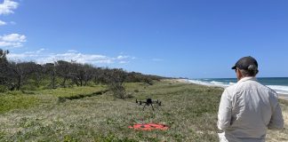 Peter from Aspect UAV flying the drone along the beach