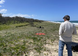 Peter from Aspect UAV flying the drone along the beach