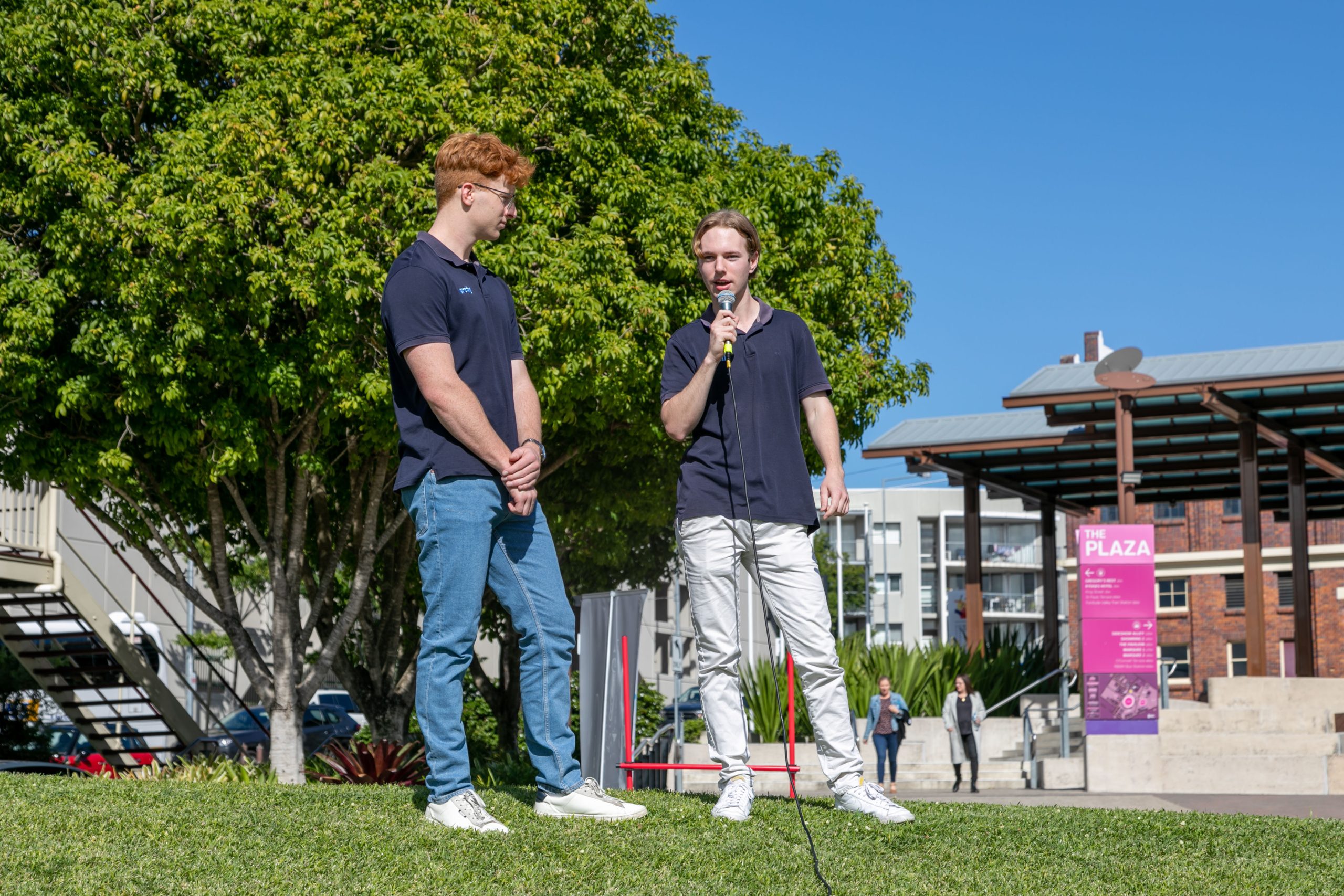 Rudi and Ben giving a presentation about drone racing to principals and teachers