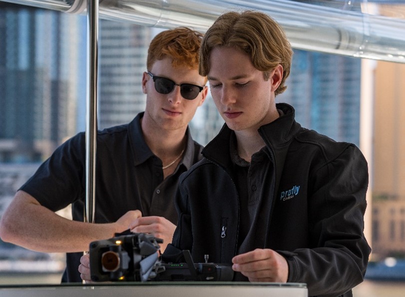 Rudi and Ben working on a drone during a shoot 