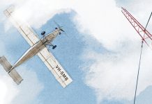 Illustration of aircraft flying towards a radio tower in patchy fog (view from ground looking up).