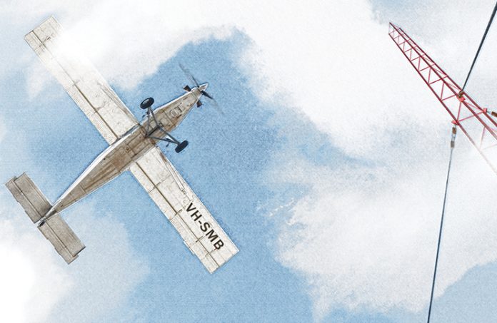 Illustration of aircraft flying towards a radio tower in patchy fog (view from ground looking up).