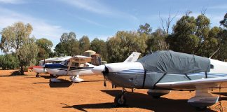 Photo of small aircraft parked on the red earth at Corynnia Station.