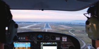 Photo from inside a cockpit of an aircraft approaching a runway