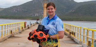 image: Melanie Olsen holding a Chasing M2 Pro drone, December 2022 | Australian Institute of Marine Science, Marie Roman