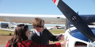 image of a pilot inspecting a light aircraft
