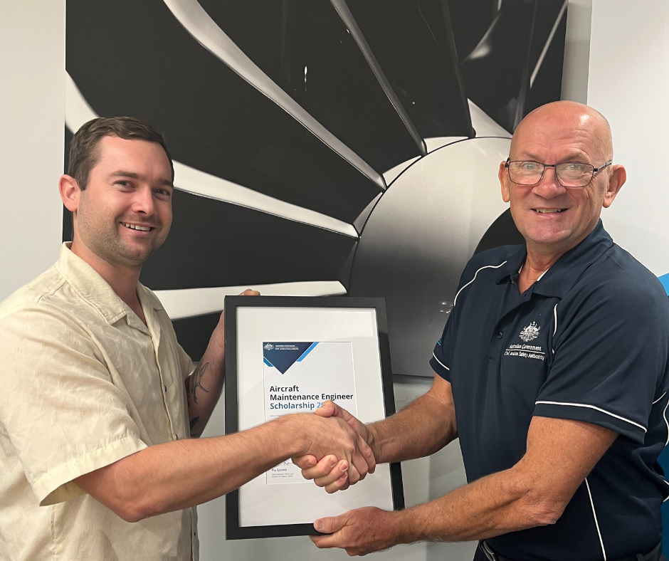 2024 AME scholarship winner Kurt Kinlyside receives his certificate from Pete Ball, Aviation Safety Advisor. Image: supplied.