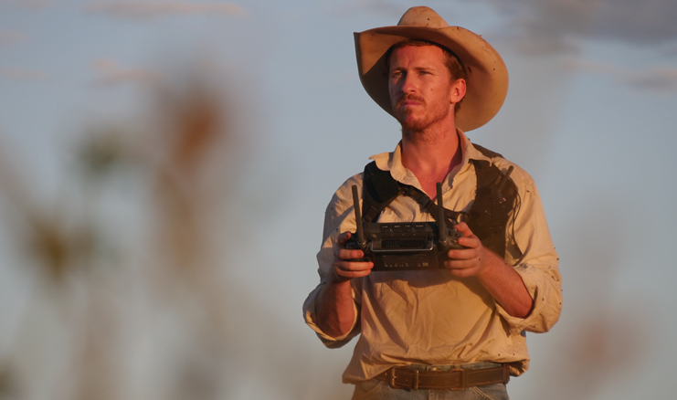 Luke Chaplain is flying a drone as part of his work with SkyKelpie, his drone mustering company.