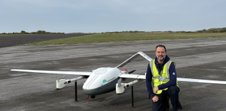 Grant Eaton on the tarmac pre-flight with a drone