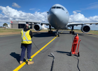 Aircraft maintenance engineer Aaron Pollard performing maintenance on an aircraft.