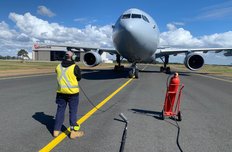 Aircraft maintenance engineer Aaron Pollard performing maintenance on an aircraft.
