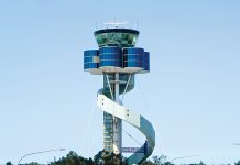A large airport control tower with a spiral staircase. AI generated content