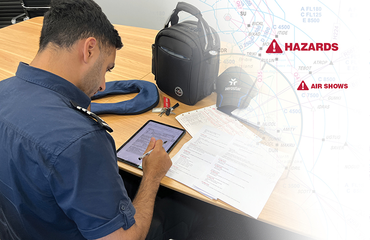 NOTAMs 1 A man is sitting at a table with an electronic flight bag and a backpack.