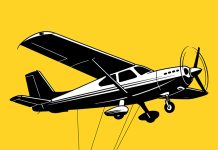 A aeroplane with several cables suspended beneath it