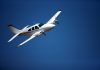 Small aircraft against blue sky