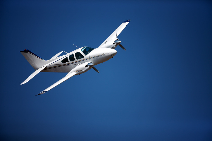 Small aircraft against blue sky