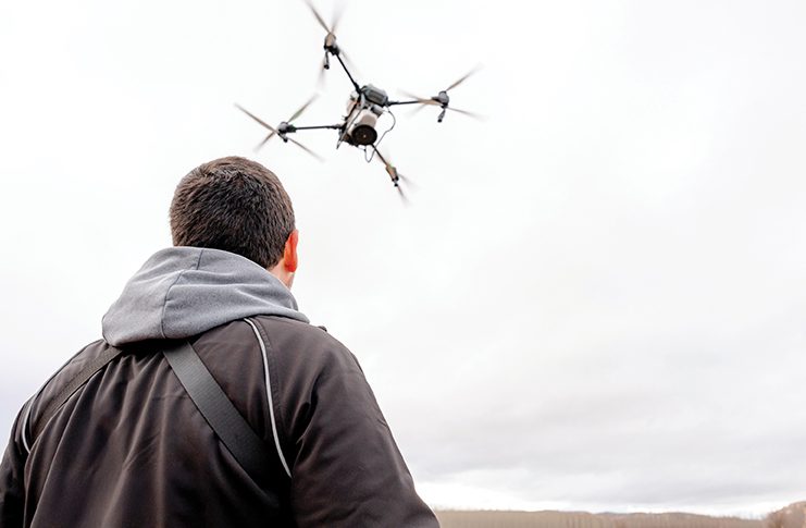 A man flying a drone