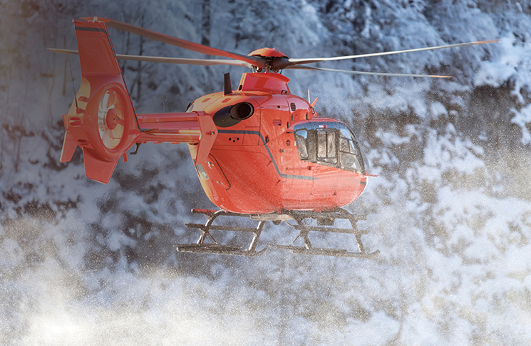 Helicopter quiz - Winter 2026 A helicopter flying with snowy trees in the background
