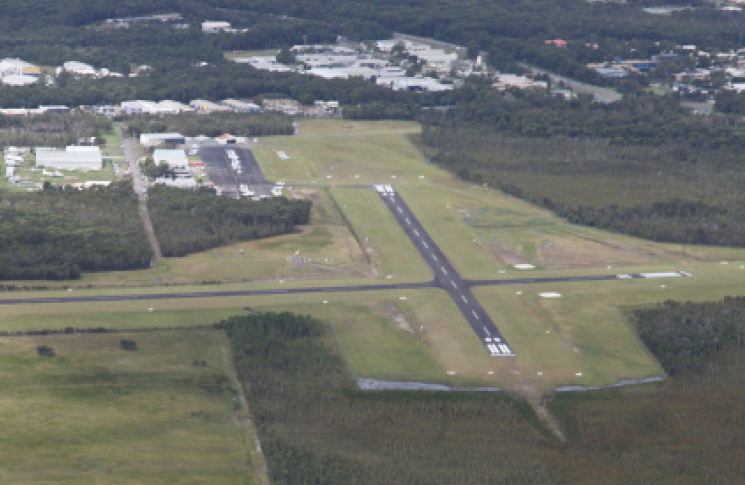 When the picture doesn't match the call: Intersecting runways at non-controlled aerodromes Aerial view of Caloundra Airport showing intersecting runways in a non-controlled environment.
