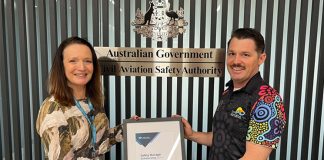 Jake Polkinghorne (right) receives the CASA Safety Manager Scholarship from Clare Willmont, Senior CASA Inspector (left), at CASA's Perth office.