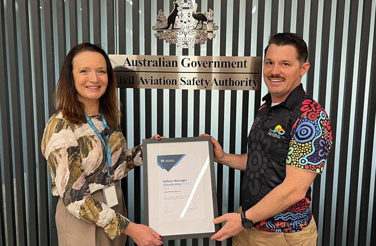 Jake Polkinghorne (right) receives the CASA Safety Manager Scholarship from Clare Willmont, Senior CASA Inspector (left), at CASA's Perth office.