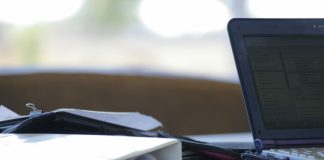 'Planning - laptop, folders and paperwork