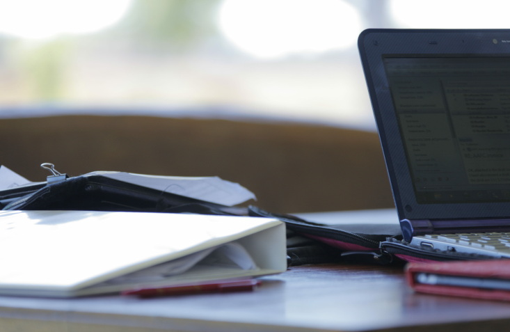 3 steps to implementation 'Planning - laptop, folders and paperwork